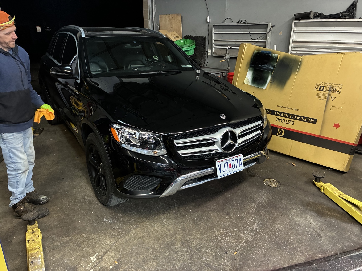 Black Mercedes SUV in shop bay